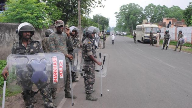Policemen deployed in Manuwa village following communal tension after a Muslim trader was lynched by mob on Thursday. Eight of the accused have been arrested so far . (Hindustan Times) Policemen deployed in Manuwa village following communal tension after a Muslim trader was lynched by mob on Thursday. Eight of the accused have been arrested so far . (Hindustan Times)