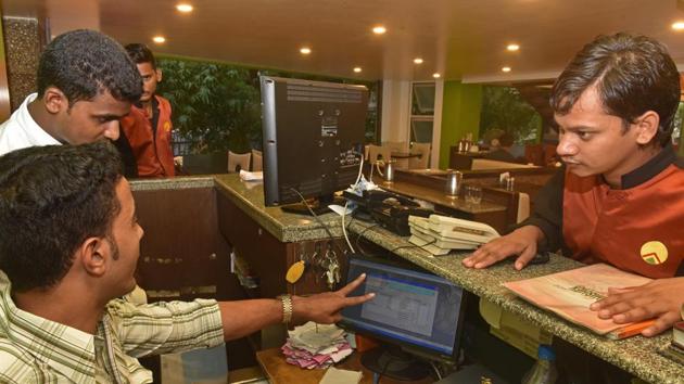 A hotel manager explains GST to his staff in Erandvane in Pune on Saturday.(Pratham Gokhale/HT Photo)