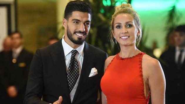 Uruguayan football player Luis Suarez and his wife Sofia Balbi pose on the red carpet. (AFP)