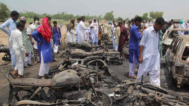 This file photo taken on June 26, 2017 shows Pakistani villagers gathering at the site of a deadly oil tanker fire following an accident in the town of Ahmedpur East. R (AFP) This file photo taken on June 26, 2017 shows Pakistani villagers gathering at the site of a deadly oil tanker fire following an accident in the town of Ahmedpur East. R (AFP)