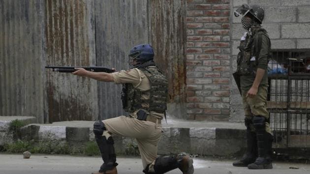 A paramilitary personnel fires a pellet gun during a protest after in Srinagar.(AP FILE PHOTO) A paramilitary personnel fires a pellet gun during a protest after in Srinagar.(AP FILE PHOTO)