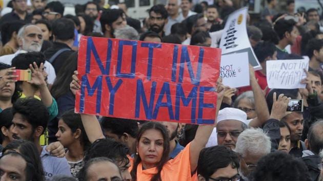 Bollywood actress Shabana Azmi holds a placard high during a protest against a spate of violent attacks across the country targeting the country's Muslim minority, in Mumbai, Maharashtra. (Rafiq Maqbool / AP)