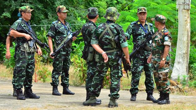 NSCN-IM rebels around their camp and the outfit's leader Thuingaleng Muivah with others. (HT File Photo) NSCN-IM rebels around their camp and the outfit's leader Thuingaleng Muivah with others. (HT File Photo)