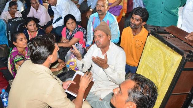 A man talks to a police officials after the group with the 125kg bar of soap was detained.(HT Photo) A man talks to a police officials after the group with the 125kg bar of soap was detained.(HT Photo)