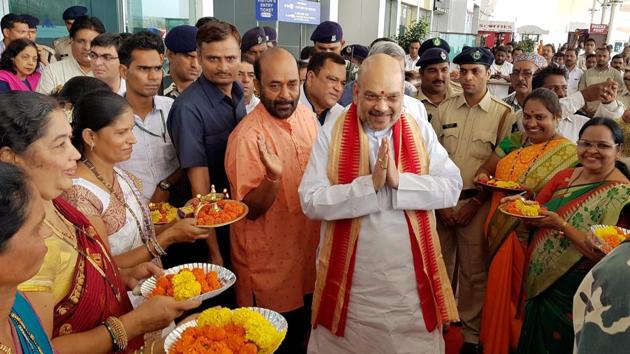 BJP president Amit Shah being welcomed upon his arrival at Dabolim airport in Goa on Saturday.(PTI Photo)