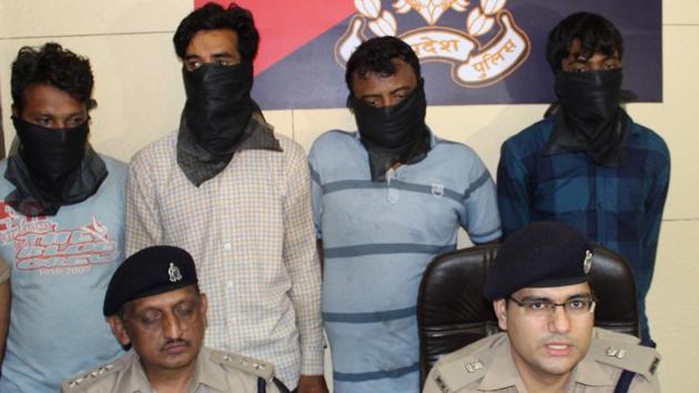 The arrested men in police custody. (Sakib Ali/ HT Photo) The arrested men in police custody. (Sakib Ali/ HT Photo)