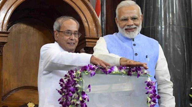President Pranab Mukherjee and Prime Minister Narendra Modi press buttons for the launch of 'Goods and Services Tax (GST)' at midnight, at the special ceremony in the Central Hall of Parliament in New Delhi on Saturday. (PTI) President Pranab Mukherjee and Prime Minister Narendra Modi press buttons for the launch of 'Goods and Services Tax (GST)' at midnight, at the special ceremony in the Central Hall of Parliament in New Delhi on Saturday. (PTI)