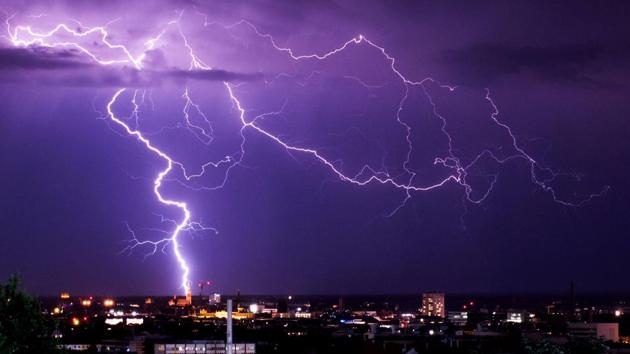 Lightning flashes over the cityscape in Munich, Germany. (Marcel Kusch / AFP) Lightning flashes over the cityscape in Munich, Germany. (Marcel Kusch / AFP)