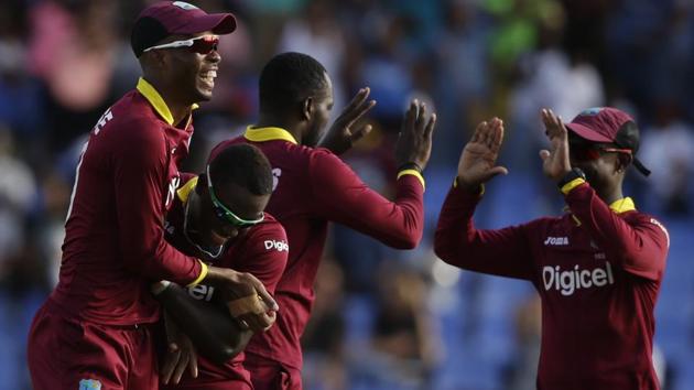 West Indies layers celebrate the dismissal of India's MS Dhoni during their fourth ODI cricket match. (AP) West Indies layers celebrate the dismissal of India's MS Dhoni during their fourth ODI cricket match. (AP)