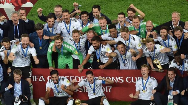 Germany's players pose with the trophy after winning the 2017 Confederations Cup final football match against Chile. (AFP) Germany's players pose with the trophy after winning the 2017 Confederations Cup final football match against Chile. (AFP)