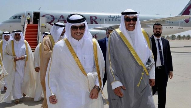 Qatari foreign minister Sheikh Mohammed bin Abdulrahman Al Thani, left, and Kuwaiti foreign minister Sheikh Sabah Khaled Al Sabah, right, walk together on an airport tarmac, on Al Thani’s arrival in Kuwait. (AP Photo) Qatari foreign minister Sheikh Mohammed bin Abdulrahman Al Thani, left, and Kuwaiti foreign minister Sheikh Sabah Khaled Al Sabah, right, walk together on an airport tarmac, on Al Thani’s arrival in Kuwait. (AP Photo)