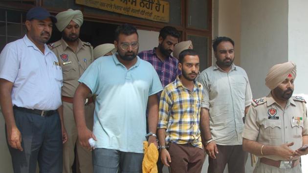 Main accused (sky blue t-shirt and check shirt) of Paras murder case coming out district court in Patiala on Monday. (HT Photo) Main accused (sky blue t-shirt and check shirt) of Paras murder case coming out district court in Patiala on Monday. (HT Photo)