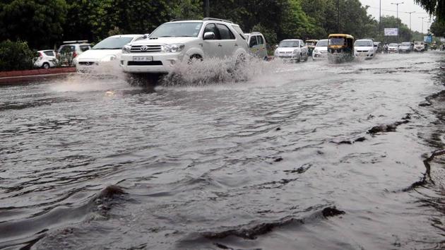 Vehicles wade through waterlogged roads at Purana Quila near Pragati Maidan on Wednesday.