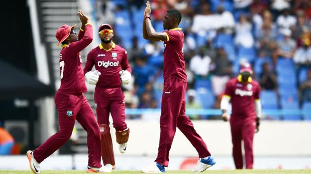 West Indies' Alzarri Joseph (R) celebrates with teammates after dismissing India's Shikhar Dhawan. (AFP) West Indies' Alzarri Joseph (R) celebrates with teammates after dismissing India's Shikhar Dhawan. (AFP)