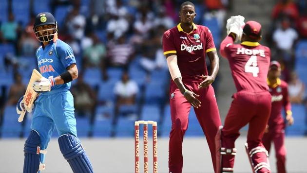 West Indies captain Jason Holder (C) celebrates the dismissal of India's Virat Kohli (L) during the fourth One Day International (ODI) match. (AFP) West Indies captain Jason Holder (C) celebrates the dismissal of India's Virat Kohli (L) during the fourth One Day International (ODI) match. (AFP)