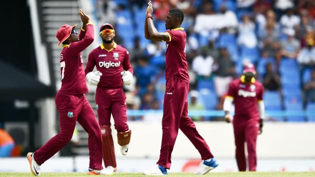 West Indies' Alzarri Joseph (R) celebrates with teammates after dismissing India's Shikhar Dhawan. (AFP) West Indies' Alzarri Joseph (R) celebrates with teammates after dismissing India's Shikhar Dhawan. (AFP)