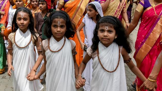 Tiny devotees, too, don’t want to be left behind. (Kunal Patil/HT Photo) 