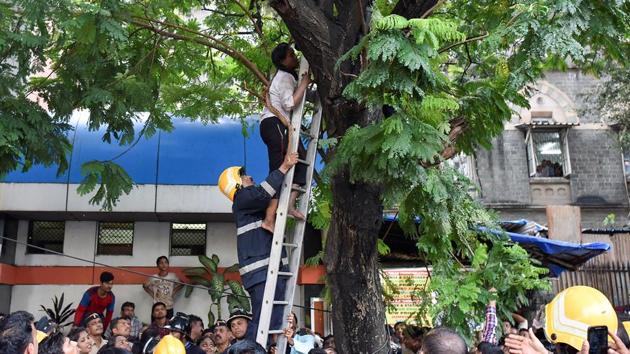 The drama ends as the woman is brought down. (Kunal Patil/HT Photo)
