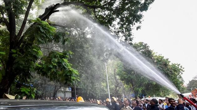 A water canon being used to get her down. (Kunal Patil/HT Photo)