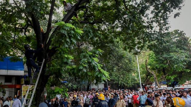 Passers-by gather at the spot. (Kunal Patil/HT Photo)