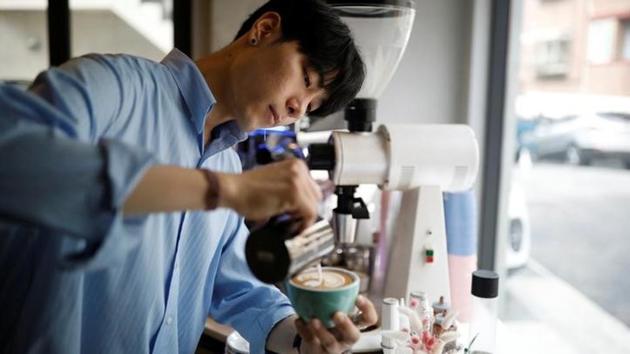 South Korean barista Lee Kang-bin makes his latte arts, called 'creamart', at his coffee shop in Seoul, South Korea. (Kim Hong-Ji N / Reuters) South Korean barista Lee Kang-bin makes his latte arts, called 'creamart', at his coffee shop in Seoul, South Korea. (Kim Hong-Ji N / Reuters)