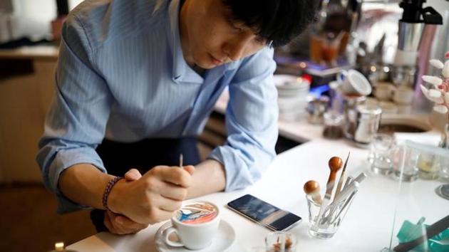 The result of the painstaking 15-minute process is a 10,000 won ($8.71) cup of cold coffee that has won Lee thousands of fans at his cafe and online. (Kim Hong-Ji N / Reuters) The result of the painstaking 15-minute process is a 10,000 won ($8.71) cup of cold coffee that has won Lee thousands of fans at his cafe and online. (Kim Hong-Ji N / Reuters)
