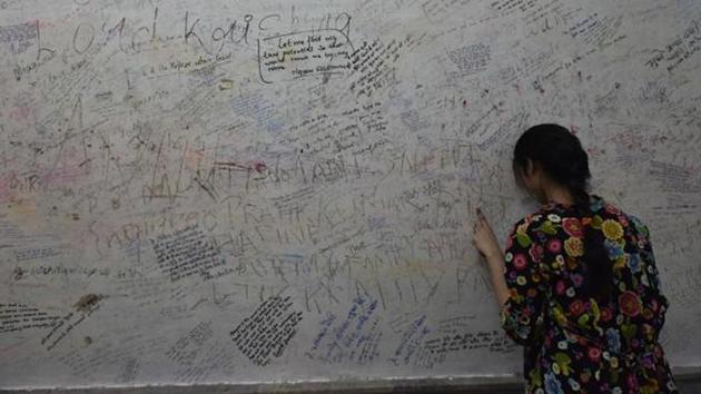 Kota’s Radha Krishan Temple has messages written all over its walls by students seeking divine help.(Raj K Raj/ HT Photo)