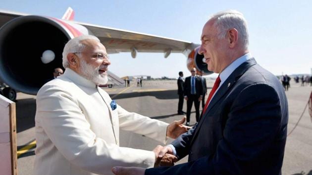 Prime Minister, Narendra Modi being received by the Prime Minister of Israel, Benjamin Netanyahu, on his arrival, at Ben Gurion Airport, in Tel Aviv , Israel on Tuesday.(PTI Photo)