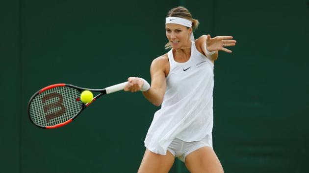 Luxembourg's Mandy Minella in action during her first round match against Italy's Francesca Schiavone at Wimbledon.(Reuters)