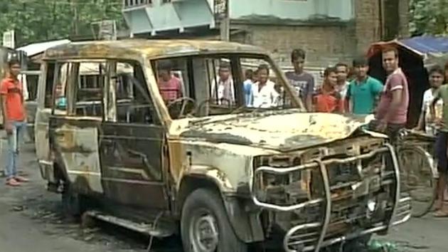Police vehicles were burnt by the angry mob in Baduria block of North 24 Paraganas district in West Bengal. (ANI Photo) Police vehicles were burnt by the angry mob in Baduria block of North 24 Paraganas district in West Bengal. (ANI Photo)