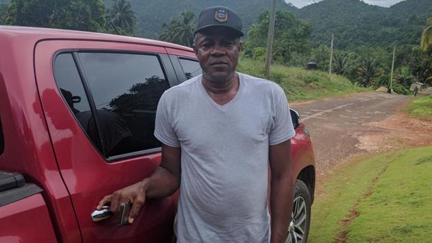 Usain’s father Wellesly with his red Toyota Hilux. (Ht Photo) 