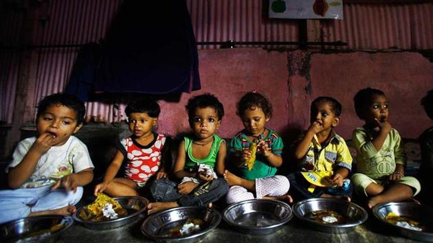 Malnourished children eat at the Apanalaya center, an organisation working for the betterment of slum children, in Mumbai.(AP File Photo)