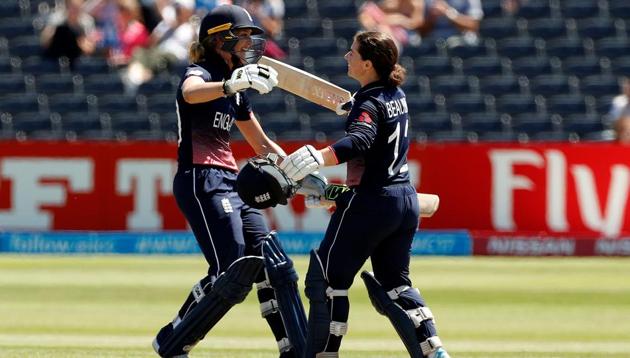 England’s Tammy Beaumont (R) celebrates her century with Sarah Taylor during an ICC Women’s World Cup match. Catch full cricket score of England vs South Africa ICC Women’s World Cup match here.(Action Images via Reuters)