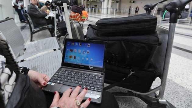 People travelling from 10 airports in eight countries to US were banned from bringing laptops, tablets and other electronic devices larger than cellphones into the flight cabin. (AFP File Photo) People travelling from 10 airports in eight countries to US were banned from bringing laptops, tablets and other electronic devices larger than cellphones into the flight cabin. (AFP File Photo)