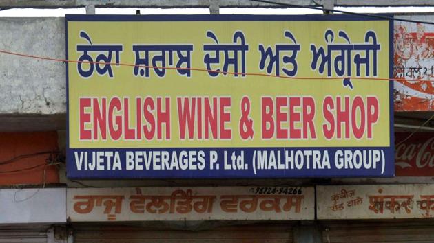 Representative Image | This picture taken on April 7, 2017 shows people walking past a closed liquor shop near a national highway on the outskirts in Amritsar. (AFP Photo) Representative Image | This picture taken on April 7, 2017 shows people walking past a closed liquor shop near a national highway on the outskirts in Amritsar. (AFP Photo)
