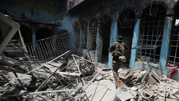 Damaged and destroyed houses dot the areas retaken by Iraqi forces and the stench of rotting bodies rises from beneath collapsed buildings. (AFP)