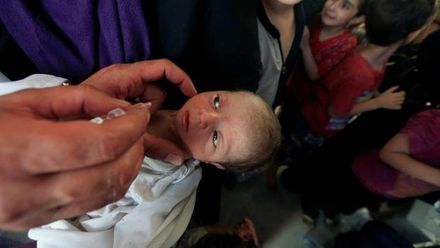 An Iraqi baby who fled from the Islamic State militants receives a vaccination against disease. Largely cut off from food and water for months, humanitarian groups are reporting a spike in the number of displaced people suffering from malnutrition and dehydration. (REUTERS)