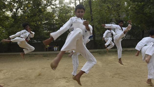 More than building power or strength, the core values of taekwondo lie in moral austerities and obtaining a high level of reaction force, concentration and equilibrium.  (Sonu Mehta/HT PHOTO) 