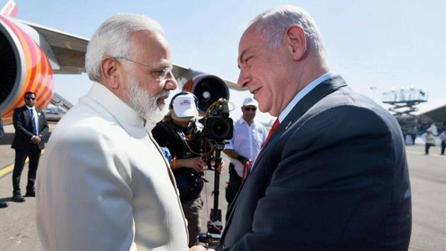 Prime Minister Narendra Modi being received by the Prime Minister of Israel Benjamin Netanyahu, on his arrival at Ben Gurion Airport, as part of a three day state visit -- the first by an Indian Premier to the Middle Eastern state since the two countries established diplomatic ties in 1992. (PTI Photo) Prime Minister Narendra Modi being received by the Prime Minister of Israel Benjamin Netanyahu, on his arrival at Ben Gurion Airport, as part of a three day state visit -- the first by an Indian Premier to the Middle Eastern state since the two countries established diplomatic ties in 1992. (PTI Photo)