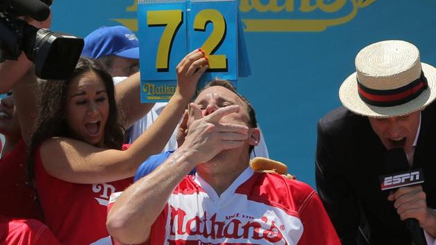 Winner Joey Chestnut competes in the final seconds of Nathan's Famous Fourth of July International Hot Dog-Eating Contest at Coney Island in Brooklyn, New York City, U.S. (REUTERS) Winner Joey Chestnut competes in the final seconds of Nathan's Famous Fourth of July International Hot Dog-Eating Contest at Coney Island in Brooklyn, New York City, U.S. (REUTERS)
