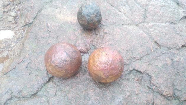 The three iron cannonballs found at the fort.
