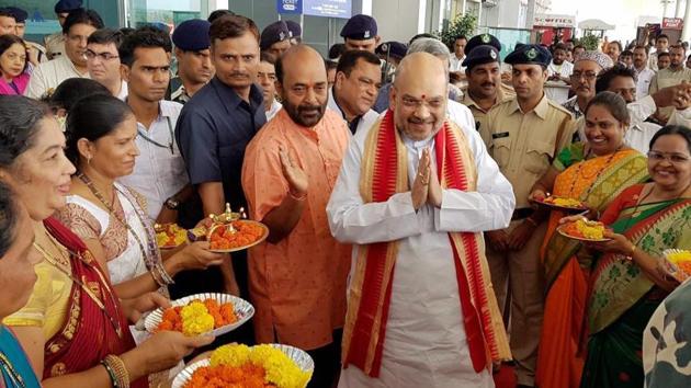 BJP president Amit Shah being welcomed after arriving at Dabolim airport in Goa on Saturday.(PTI Photo)