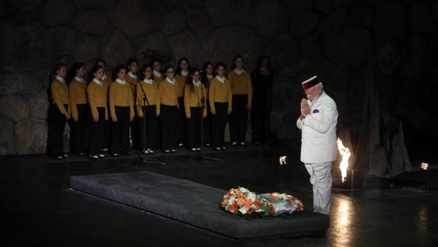 Prime Minister Narendra Modi paid respects during a visit to Yad Vashem Holocaust Memorial where he rekindled the Eternal Flame and also visited the Hall of Names in Jerusalem, Israel. (AP) 