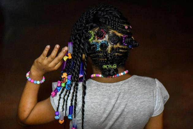 While slavery was abolished in Colombia on May 21, 1851, many were still mistreated and forced to forgo African traditions, such as braiding. (LUIS ROBAYO / AFP) 