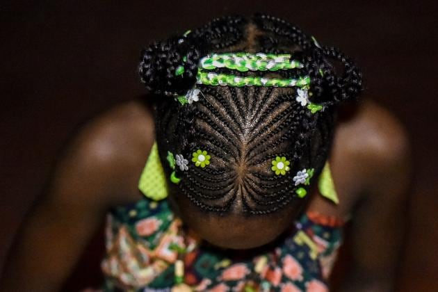 The category of children’s hairstyles had abundance of colourful and fun hairbraids. (LUIS ROBAYO / AFP) 
