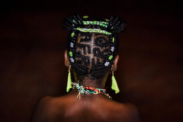 A woman shows an Afro-Colombian hairstyle during the 13th contest of Afro hairdressers ‘Tejiendo Esperanzas’ (Weaving Hopes) in Cali. (LUIS ROBAYO / AFP) 