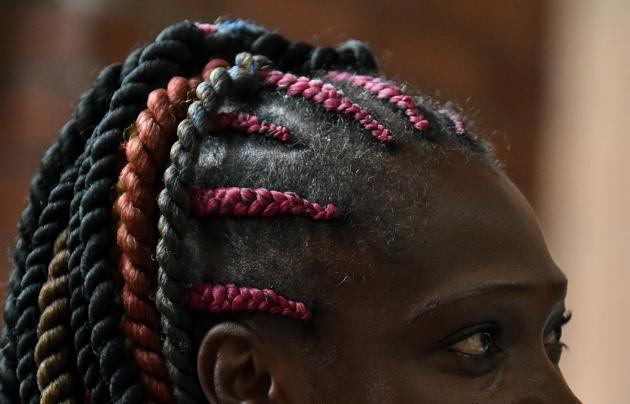 Women and young girls of all ages turned up for the ‘Tejiendo Esperanzas’ (Knitting Hope) competition in Colombia. (LUIS ROBAYO / AFP) 