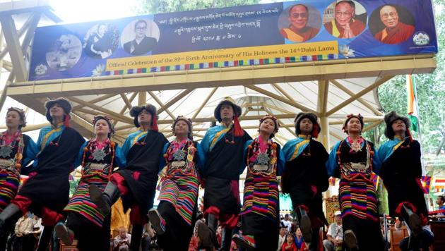 Dalai Lama fled Lhasa in 1959 after a failed uprising against the Chinese. The Indian government granted asylum to Dalai Lama along with scores of his followers. Tibetans living-in-exile in India celebrate 82nd birthday of their spiritual leader the Dalai Lama at Tsuglhakhang temple in McLeodganj, near Dharamsala, on Thursday.  (Shyam Sharma/HT Photo) 