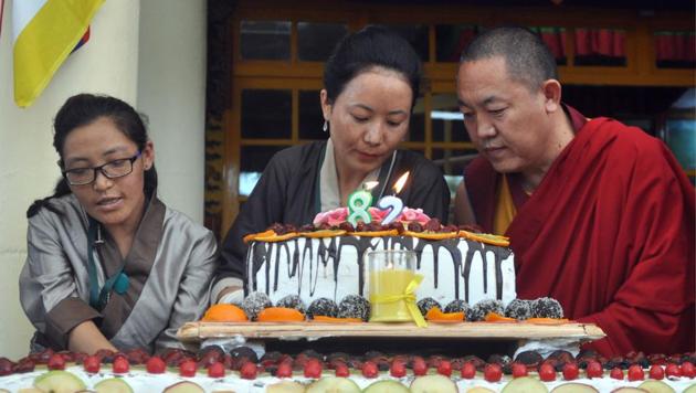 Born on July 6, 1935, at Taktser hamlet in northeastern Tibet, the Dalai Lama was recognised at the age of two as the reincarnation of the 13th Dalai Lama, Thubten Gyatso. Tibetans lcut a birthday cake as they celebrate the 82nd birthday of their spiritual leader the Dalai Lama at Tsuglhakhang temple at McLeodganj, near Dharamsala, on Thursday. (Shyam Sharma/HT Photo) 
