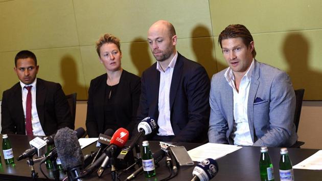 Cricketers Usman Khawaja (L), Clea Smith (2/L), Shane Watson (R) and Australian Cricketers' Association (ACA) chief executive Alistair Nicholson (2/R) attend a press conference in Sydney on July 2, 2017. Australia A boycotted this month's tour to South Africa, escalating a bitter pay dispute which threatens to derail senior tours to Bangladesh and India as well as this year's home Ashes.(AFP)